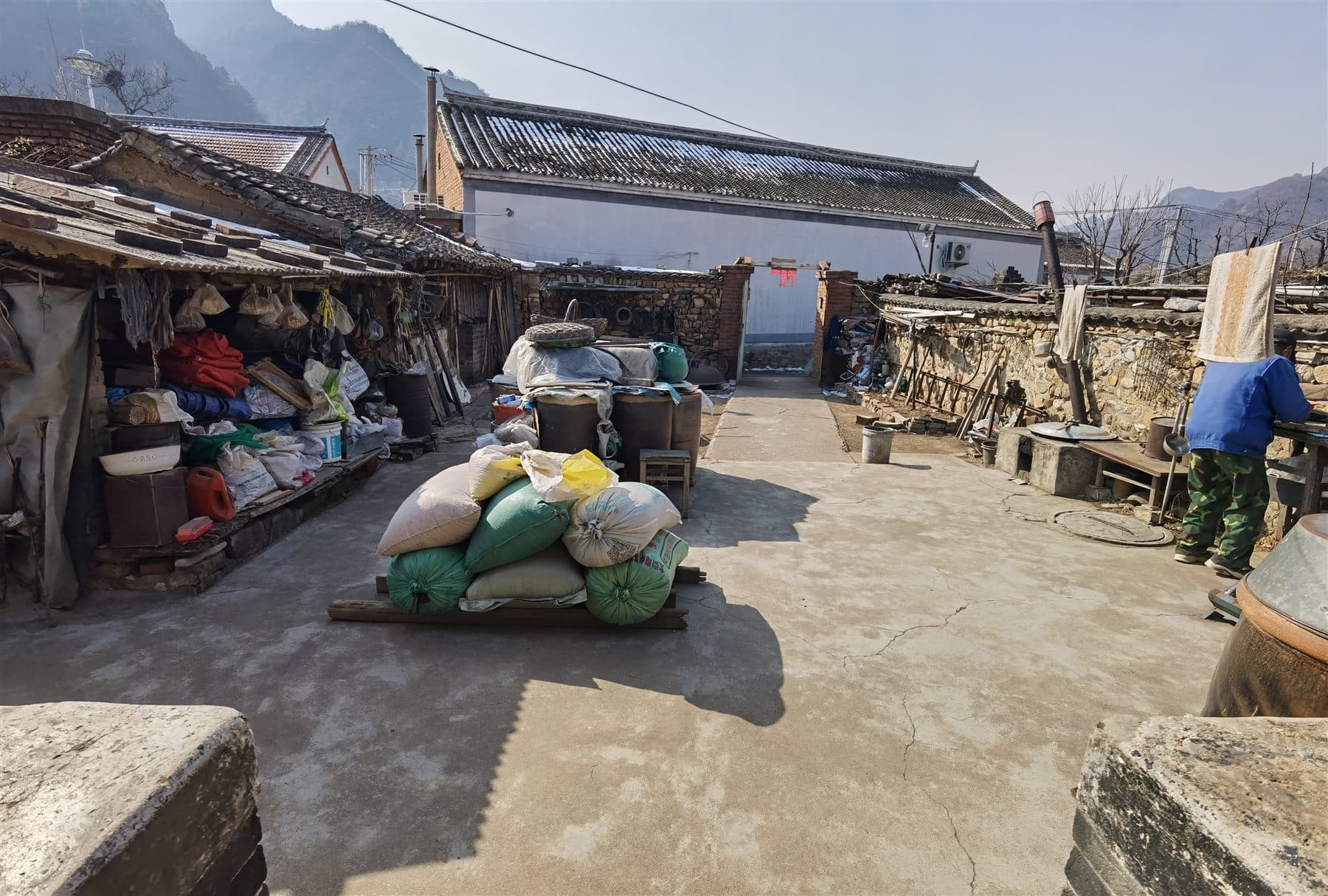 Mountain village courtyard with daily-life objects